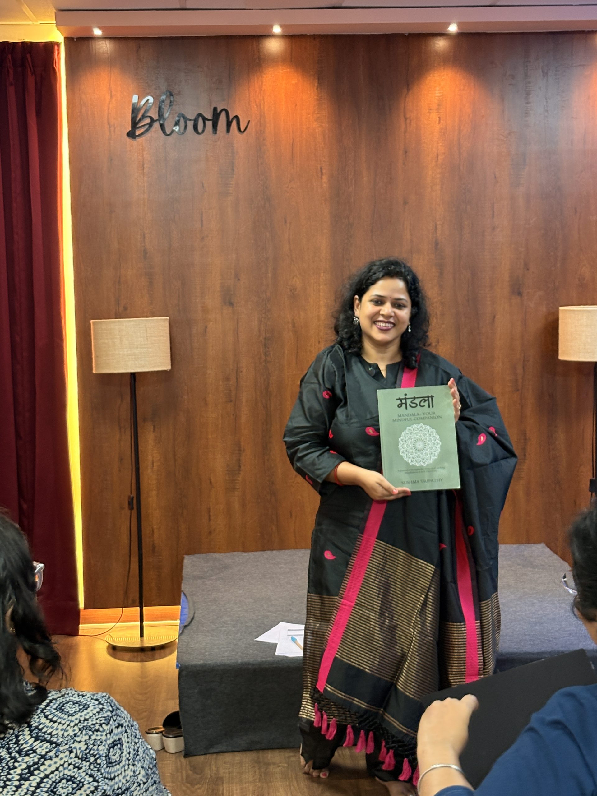 Sushma Tripathy holding her book, Mandala: Your Mindful Companion